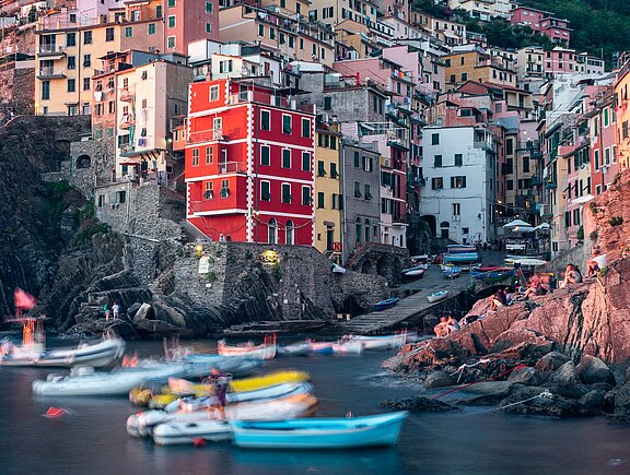 white-and-red-boat-on-water-near-brown-concrete-buildings-3711348.jpg